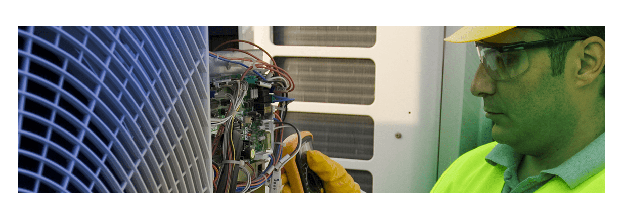 electrician working on an air conditioning panel